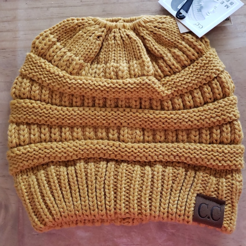 CCBeanie messey bun in a mustard color